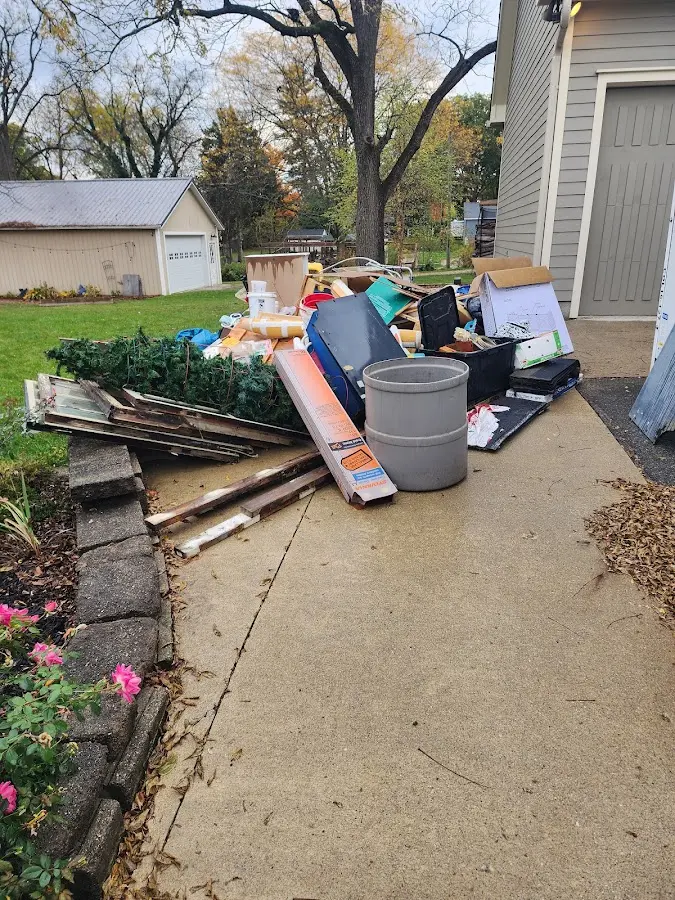 Dumpster being loaded with debris for 30 Yard Dumpster Rental in Greenwood